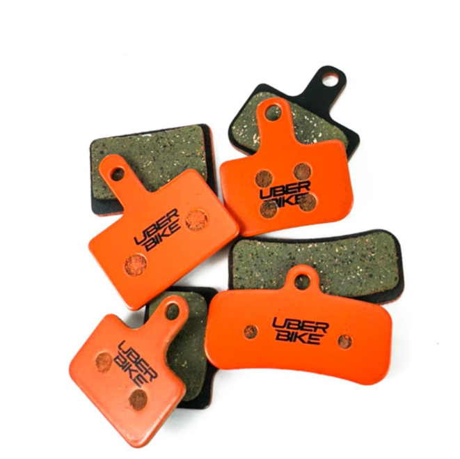 Uberbike brake pads on a white background.
