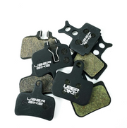 Uberbike brake pads on a white background.
