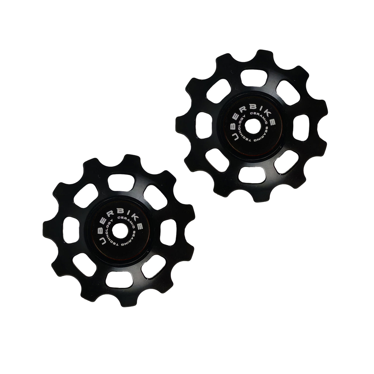 two black ceramic 11 tooth jockey wheels on a white background