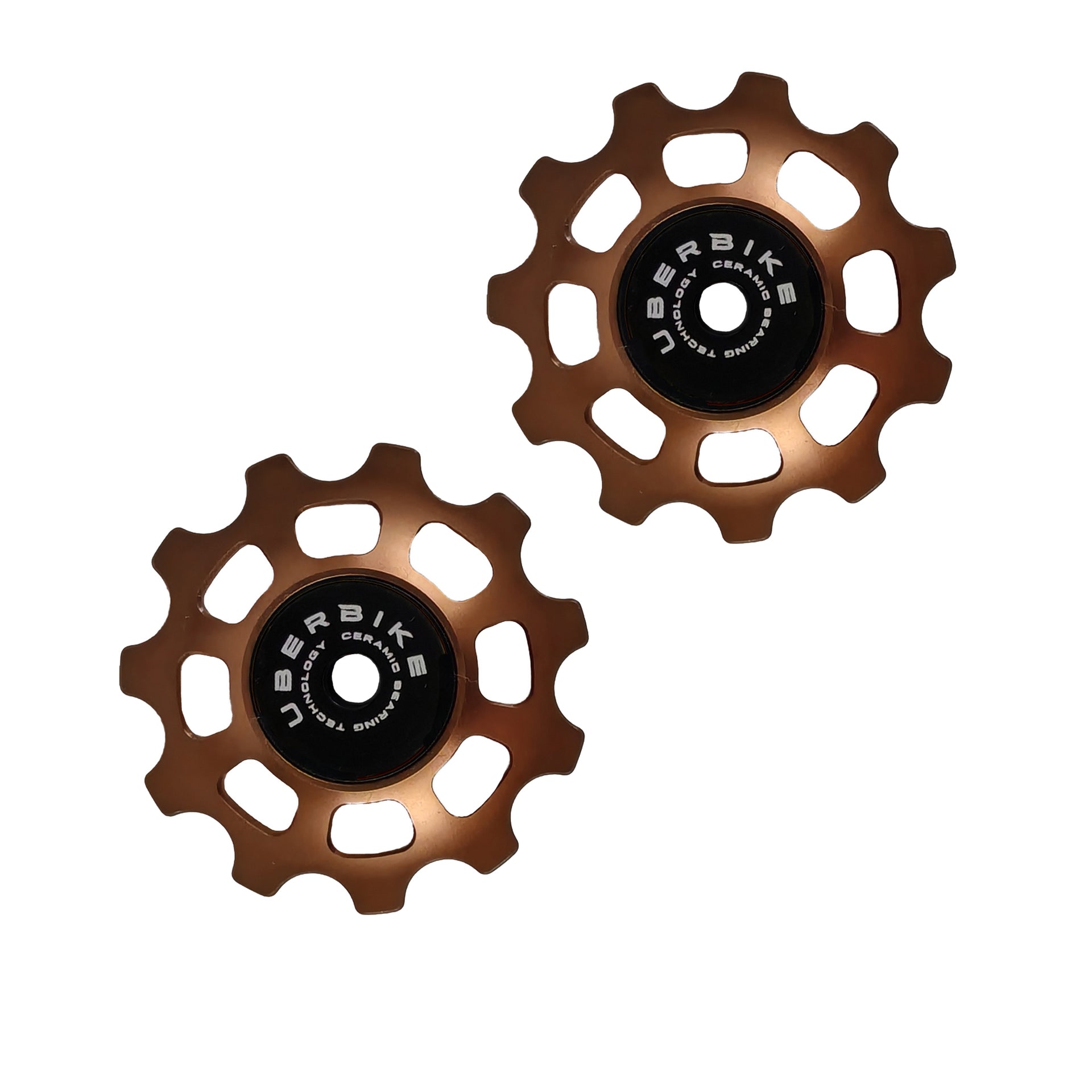 two bronze ceramic 11 tooth jockey wheels on a white background