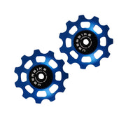 two blue steel 11 tooth jockey wheels on a white background
