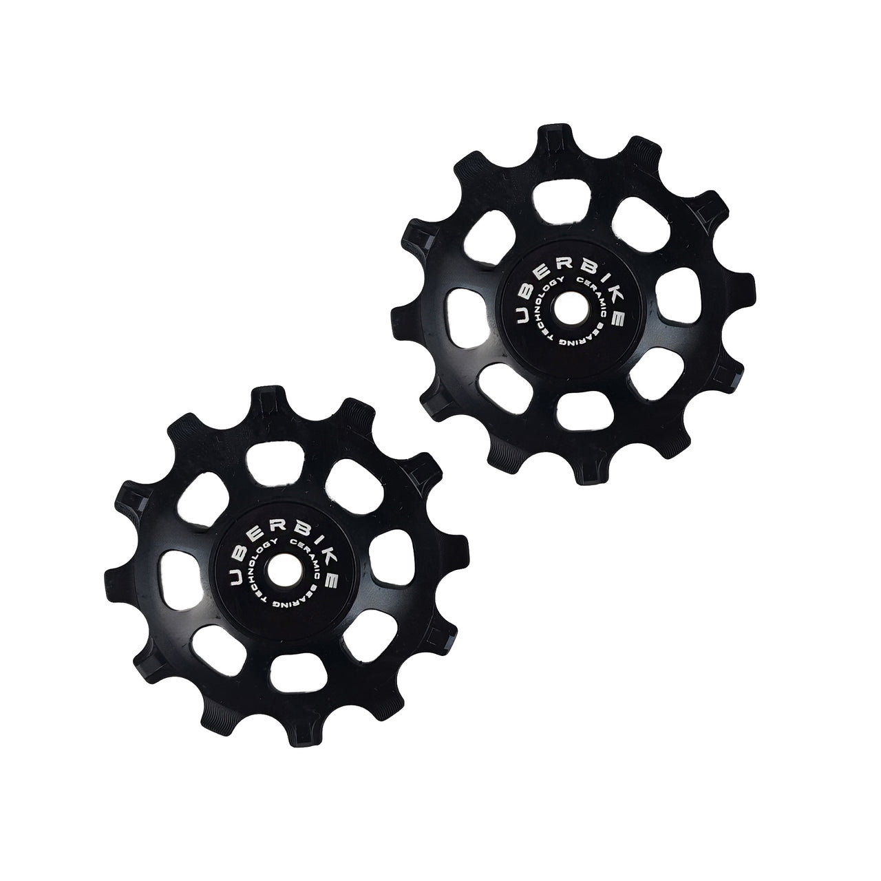 two black ceramic 12 tooth jockey wheels on a white background