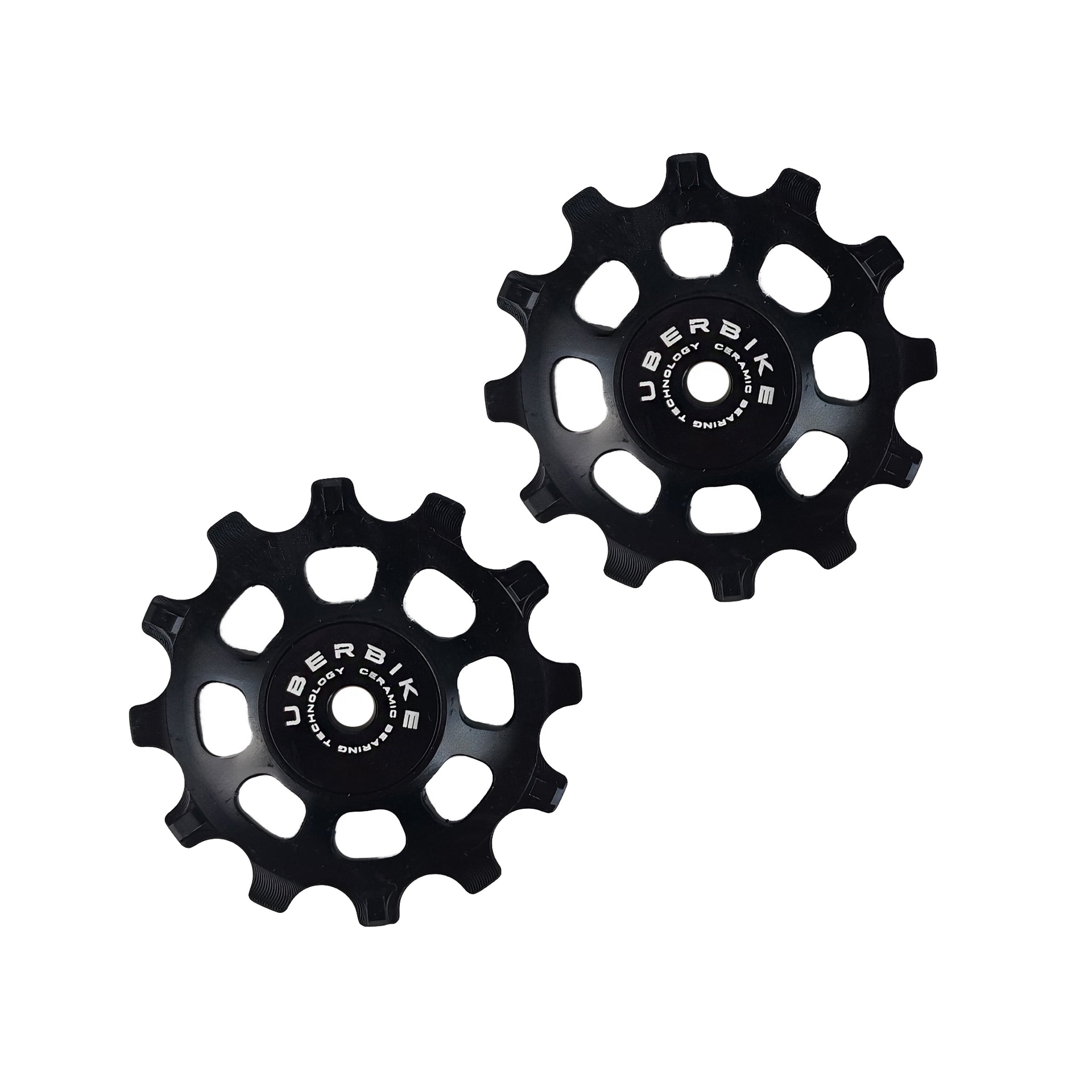 two black ceramic 12 tooth jockey wheels on a white background