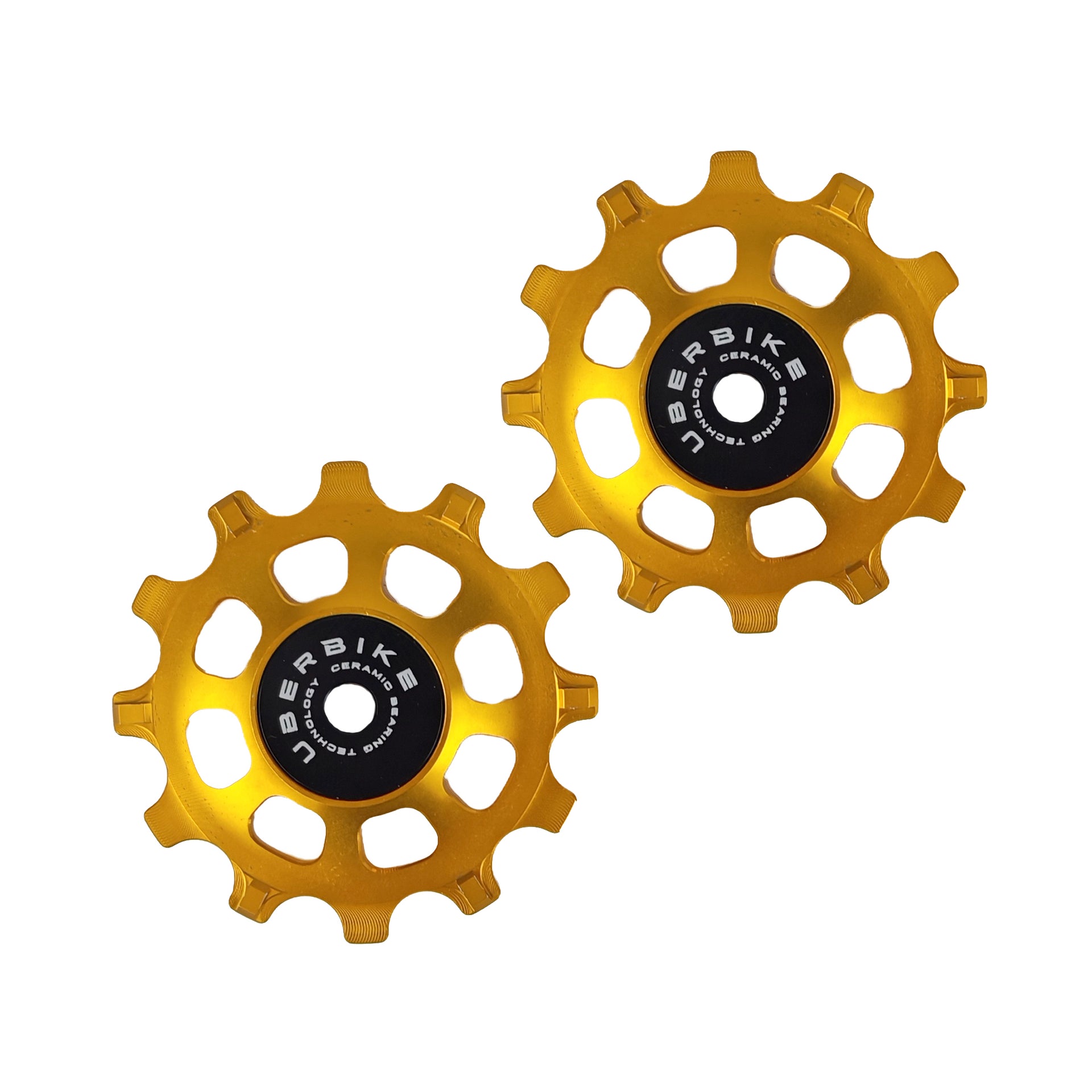 two gold ceramic 12 tooth jockey wheels on a white background