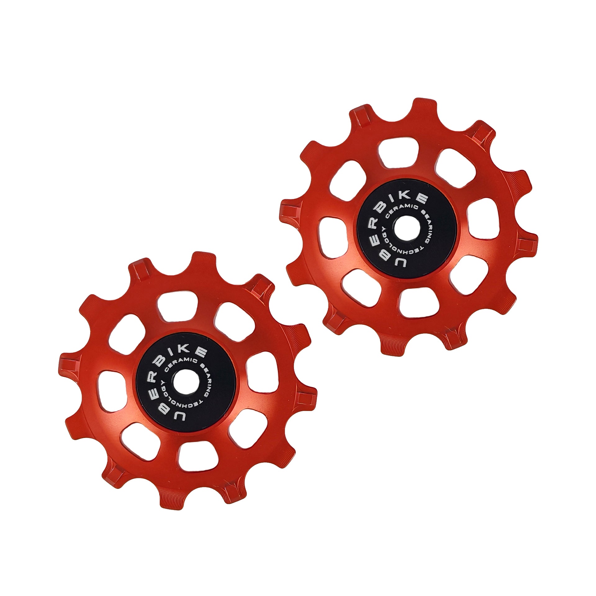 two orange ceramic 12 tooth jockey wheels on a white background