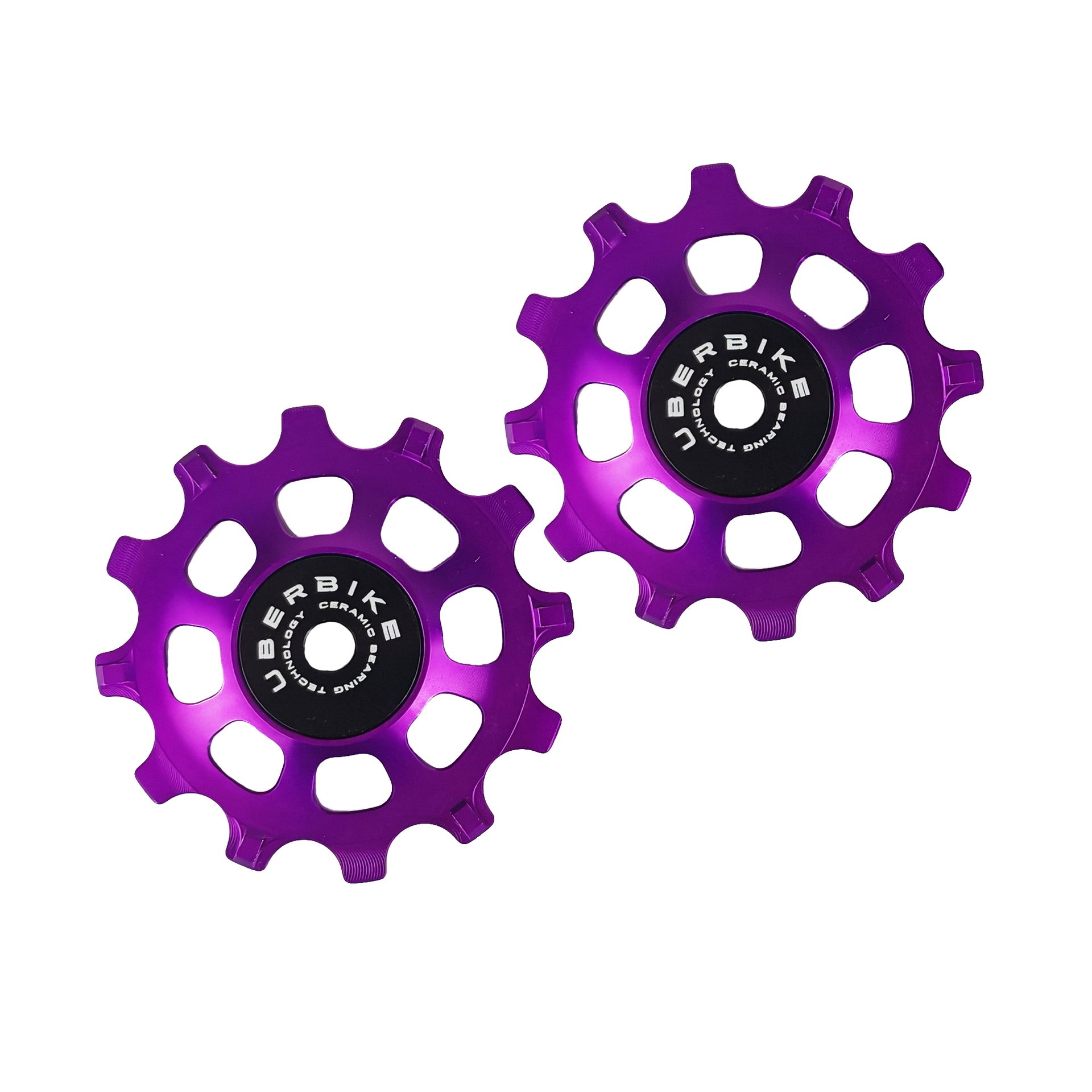 two purple ceramic 12 tooth jockey wheels on a white background