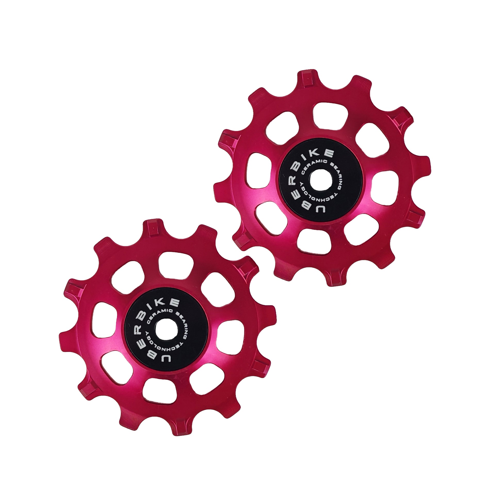two red ceramic 12 tooth jockey wheels on a white background