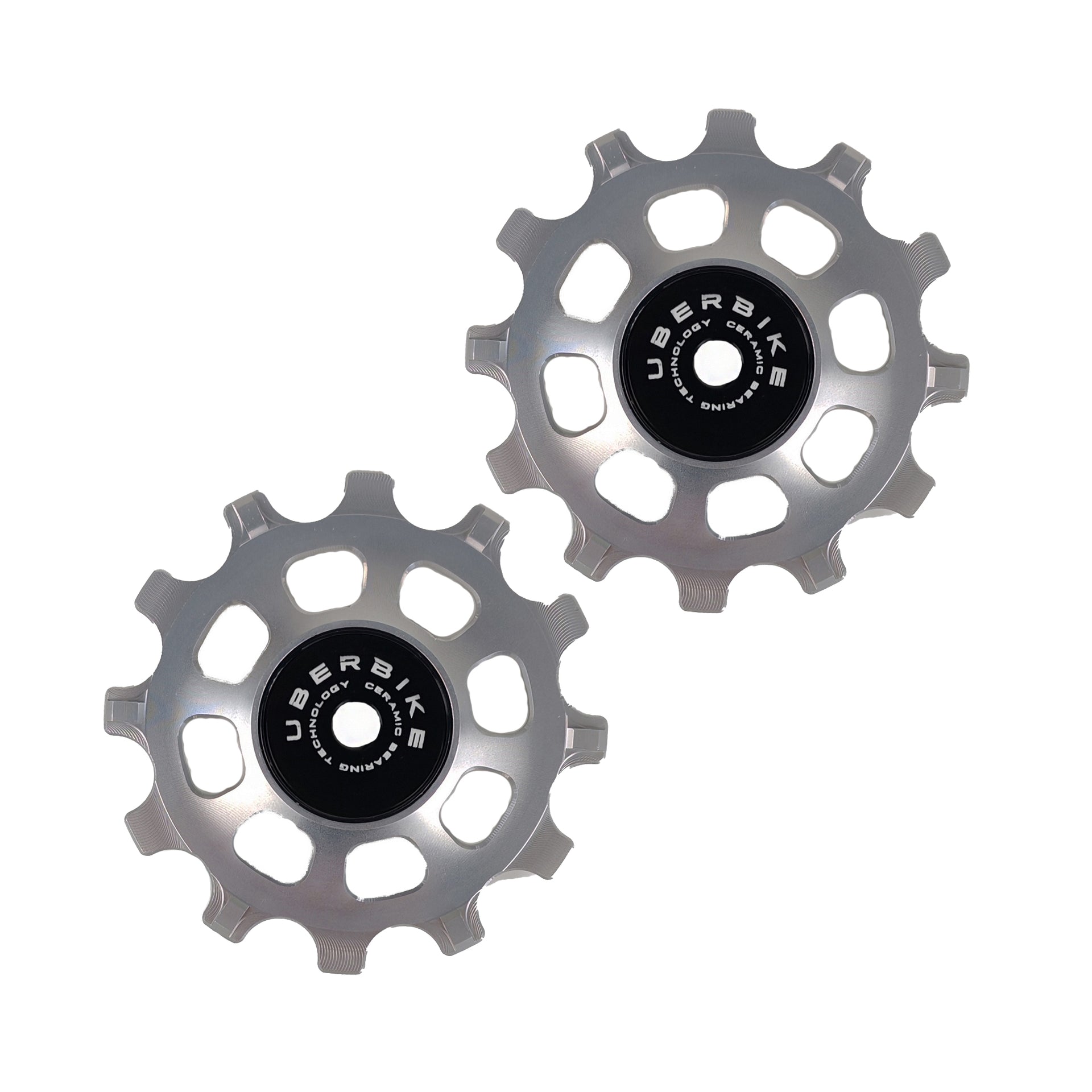 two silver ceramic 12 tooth jockey wheels on a white background