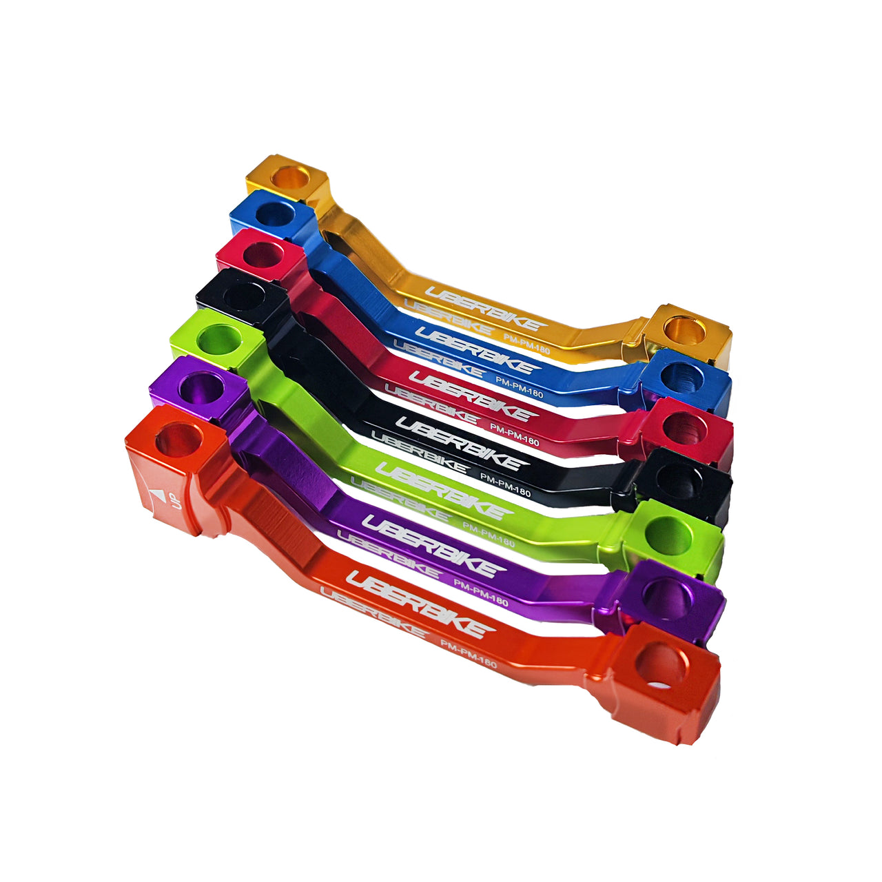 7 different coloured disc brake adapters with Uberbike branding on a white background