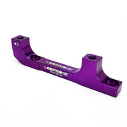 a purple post mount to post mount disc brake adapter for 160mm-220mm disc brake rotor on a white background