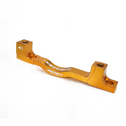 a gold post mount to post mount disc brake adapter for 180mm-220mm disc brake rotor on a white background