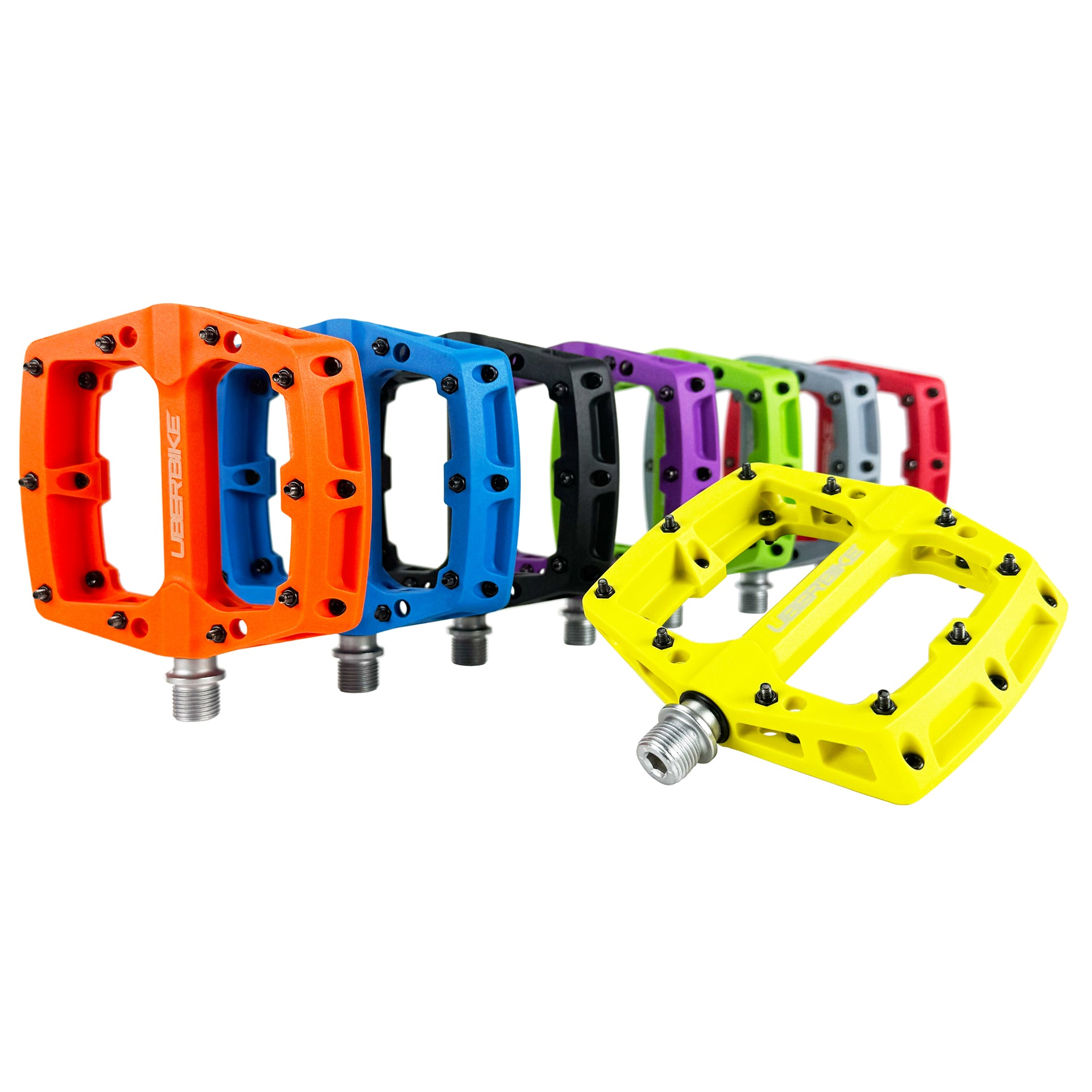 Set of colourful bicycle pedals on a white background