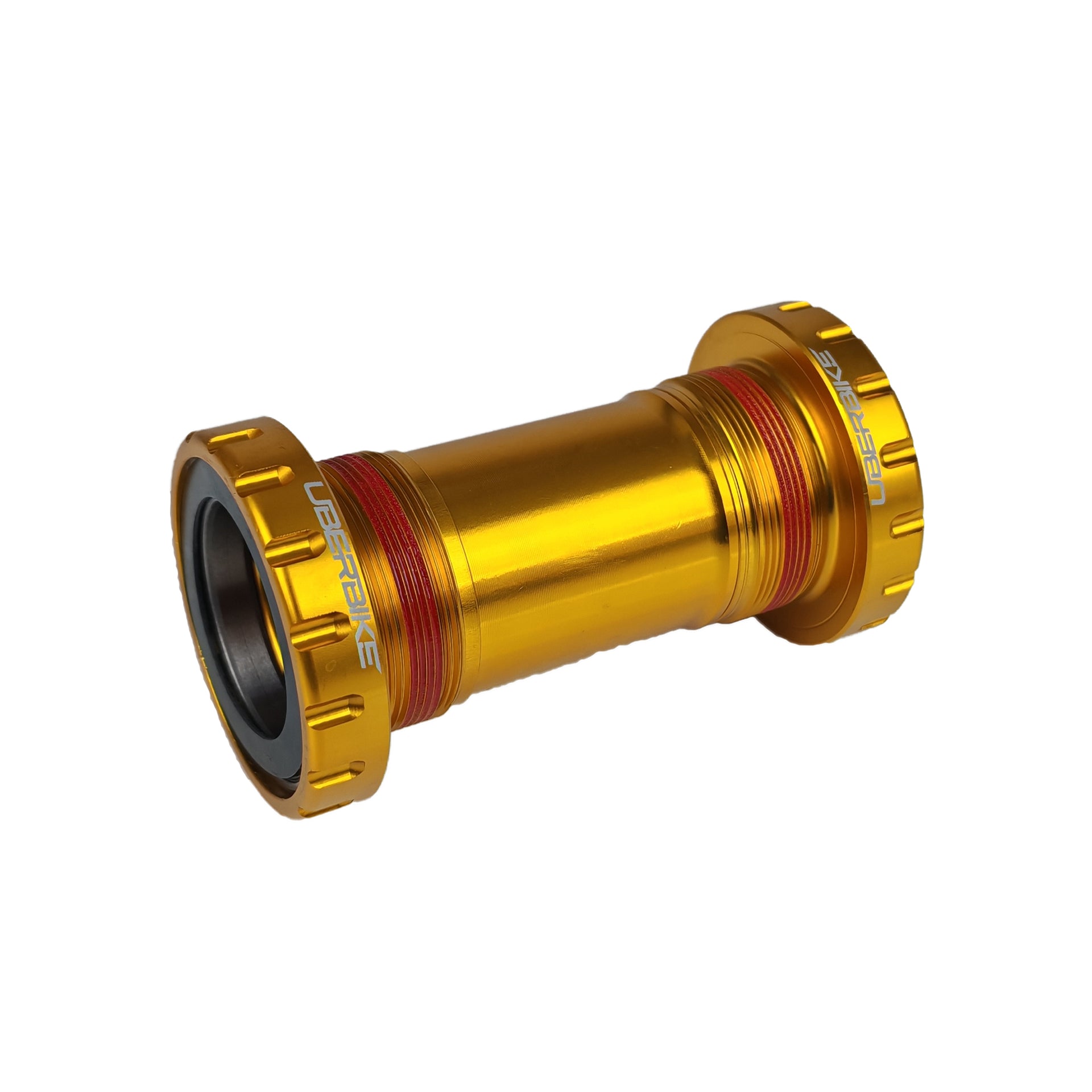 Gold BSA 30mm bottom bracket with Uberbike branding on a white background