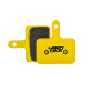 Yellow Bengal Helix 7B brake pads with Uberbike branding on a white background