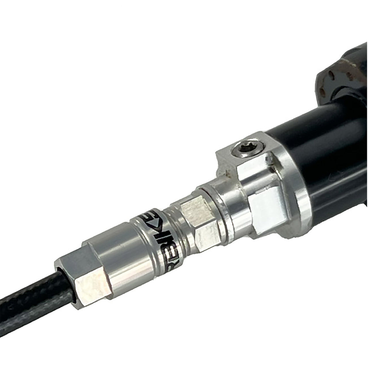 Black reverb hose installed in a dropper post on a white background