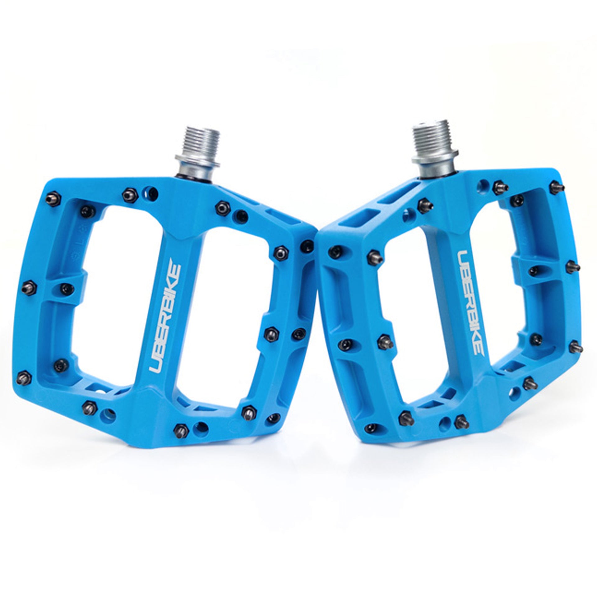 Blue apex composite pedals on a white background