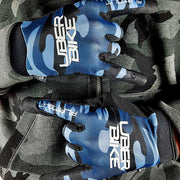 Blue camouflage gloves with Uberbike branding on a black background 