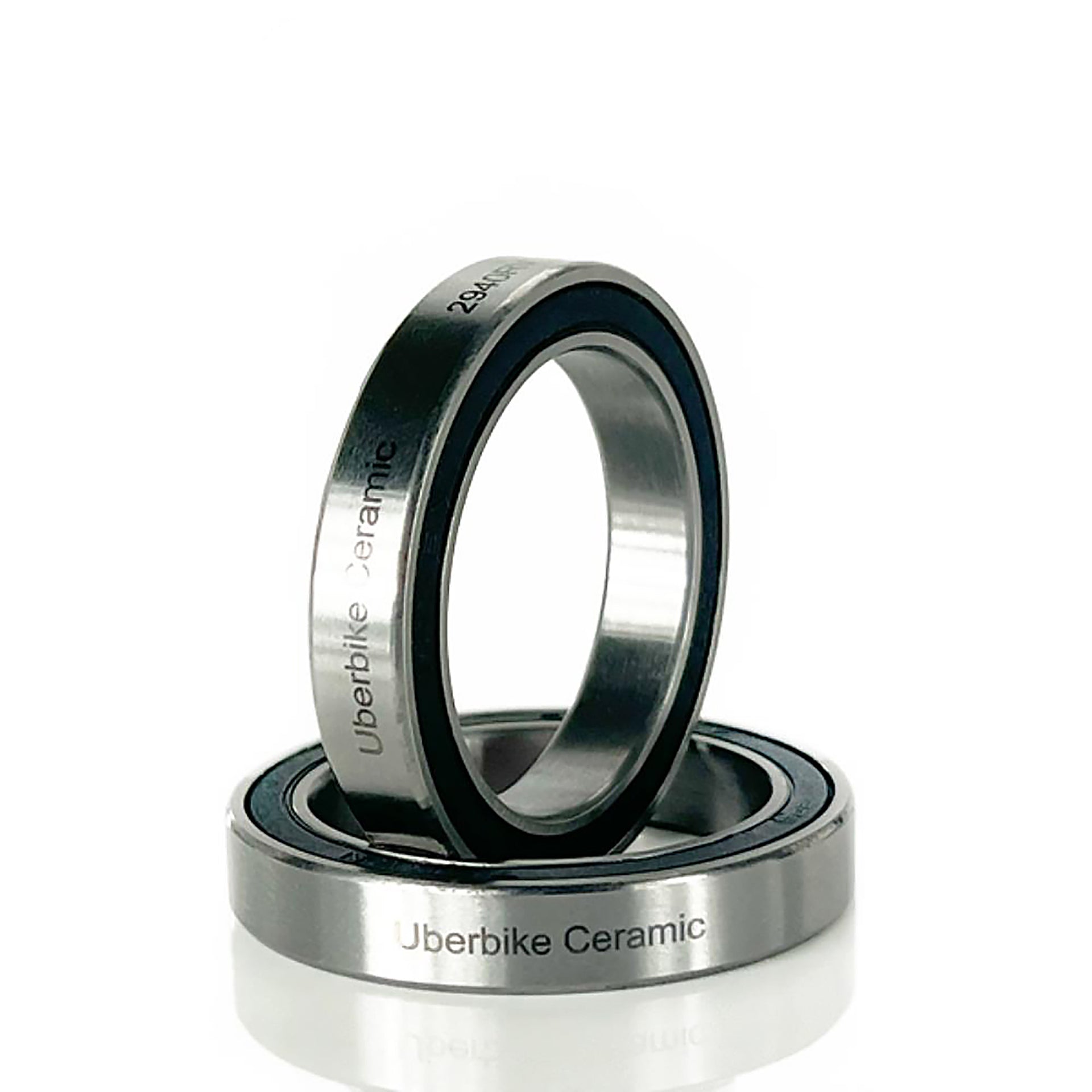 two ceramic bottom bracket bearings on a white background