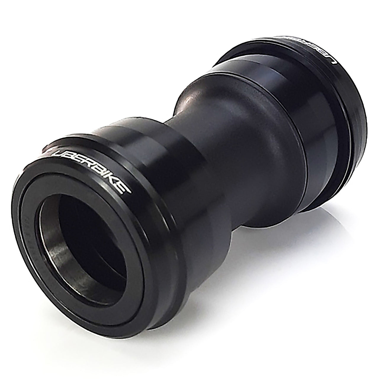 Black bicycle press fit dub bottom bracket on a white background
