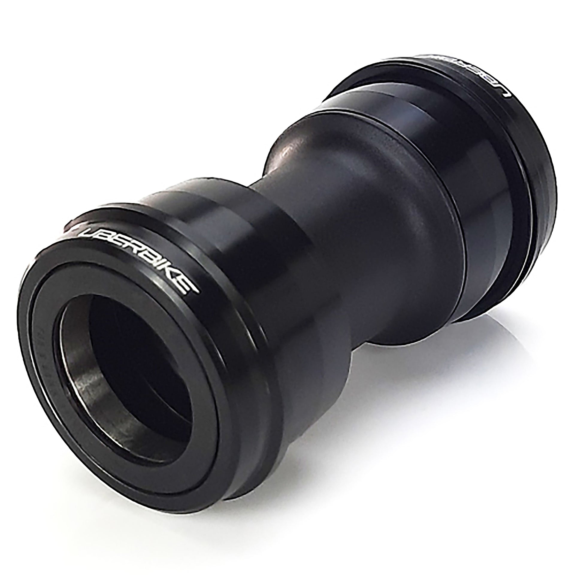 Black bicycle press fit dub bottom bracket on a white background