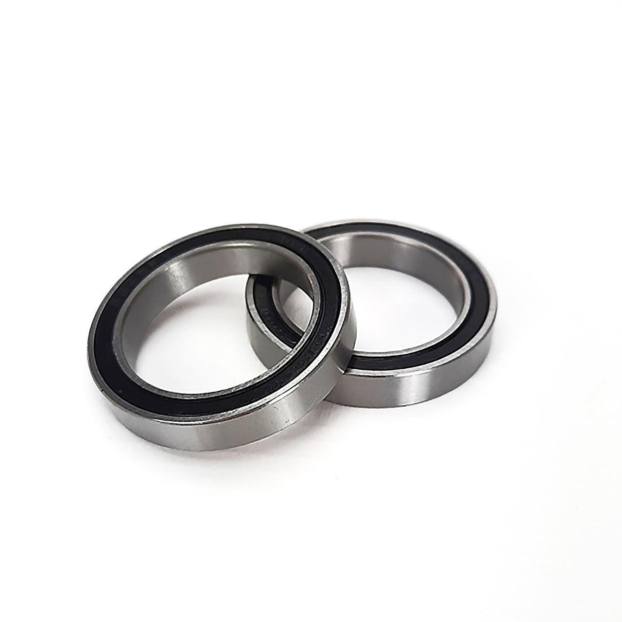 two dub steel bearings on a white background