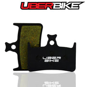 Brake pads with Uberbike branding on a white background.