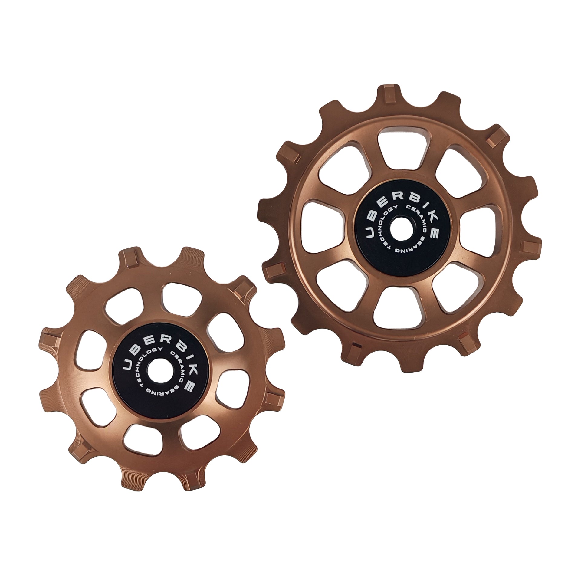 one ceramic bronze 12 tooth and one 14 tooth jockey wheel on a white background