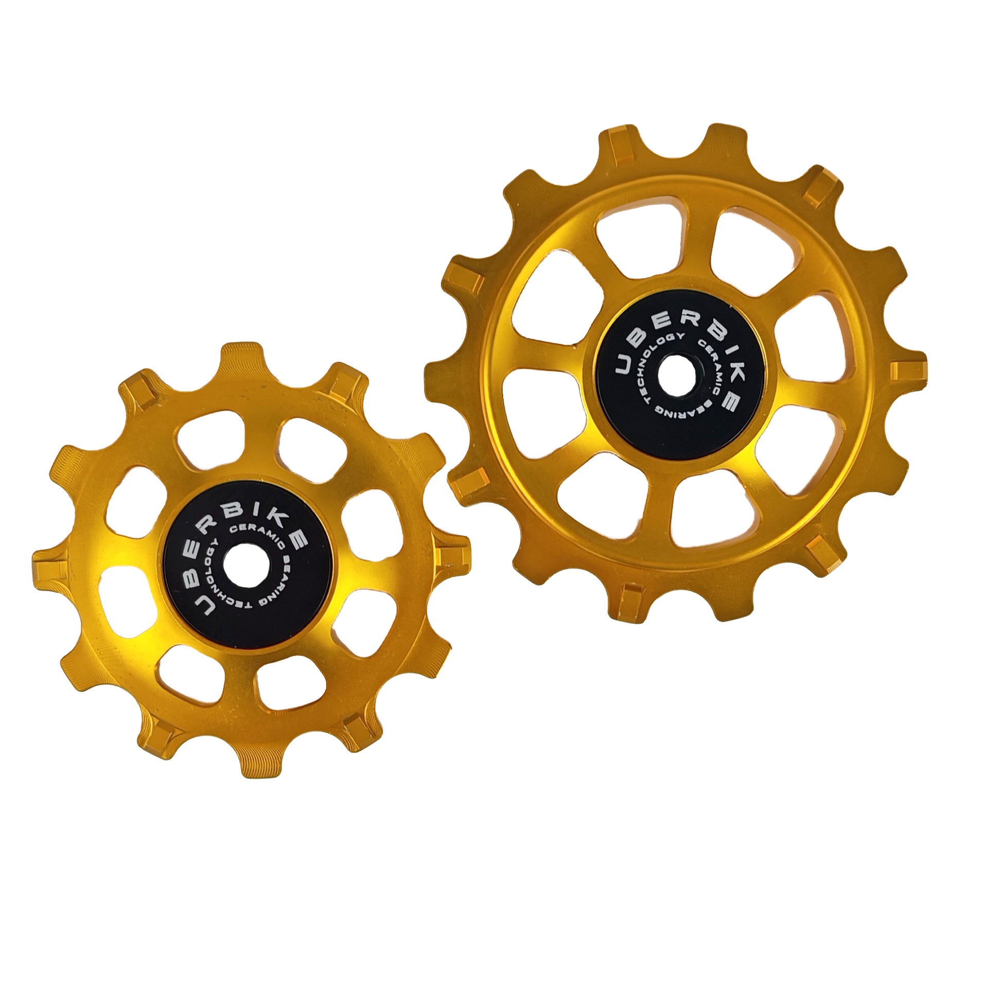 one ceramic gold 12 tooth and one 14 tooth jockey wheel on a white background