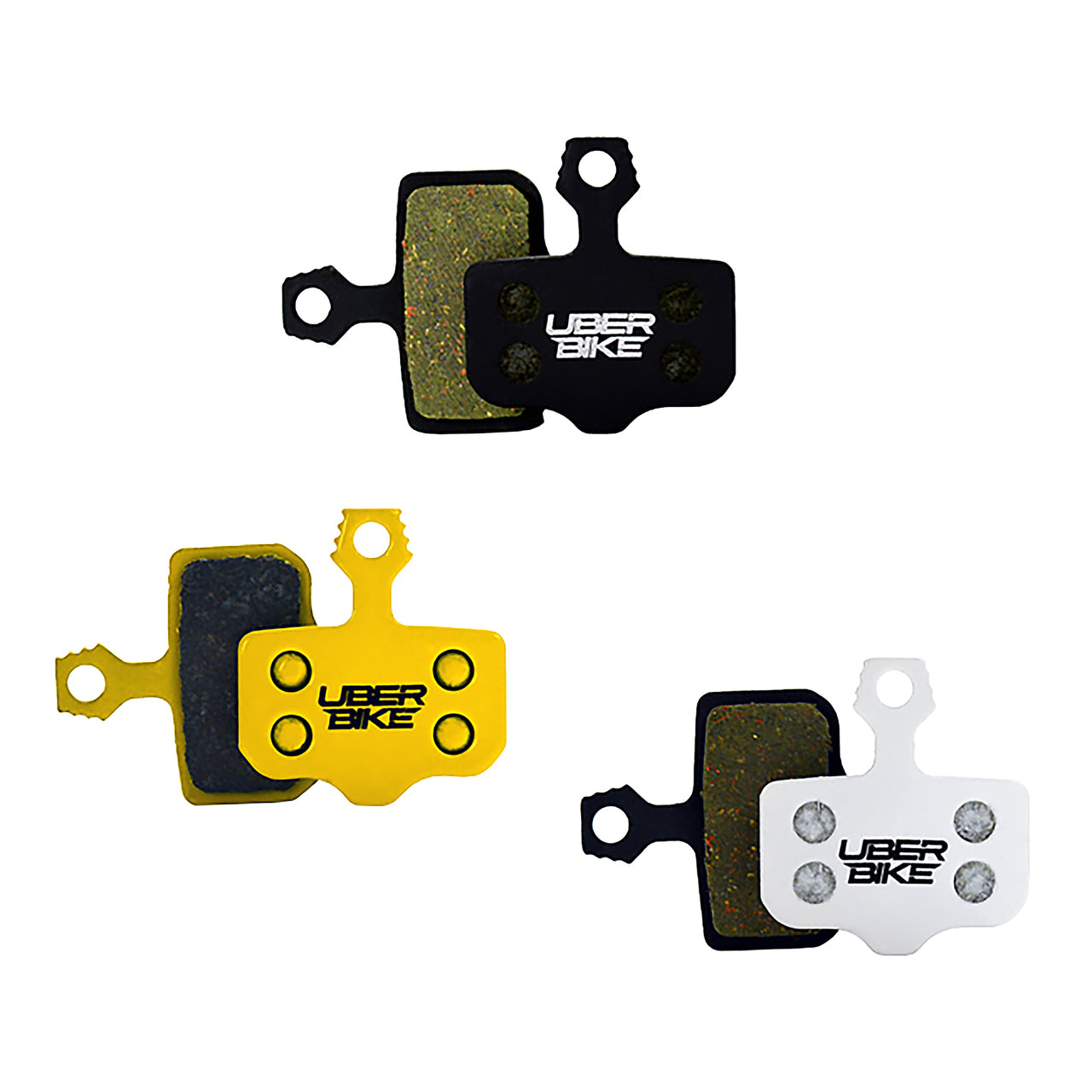 3 sets of Uberbike brake pads in black, yellow, and white on a white background.