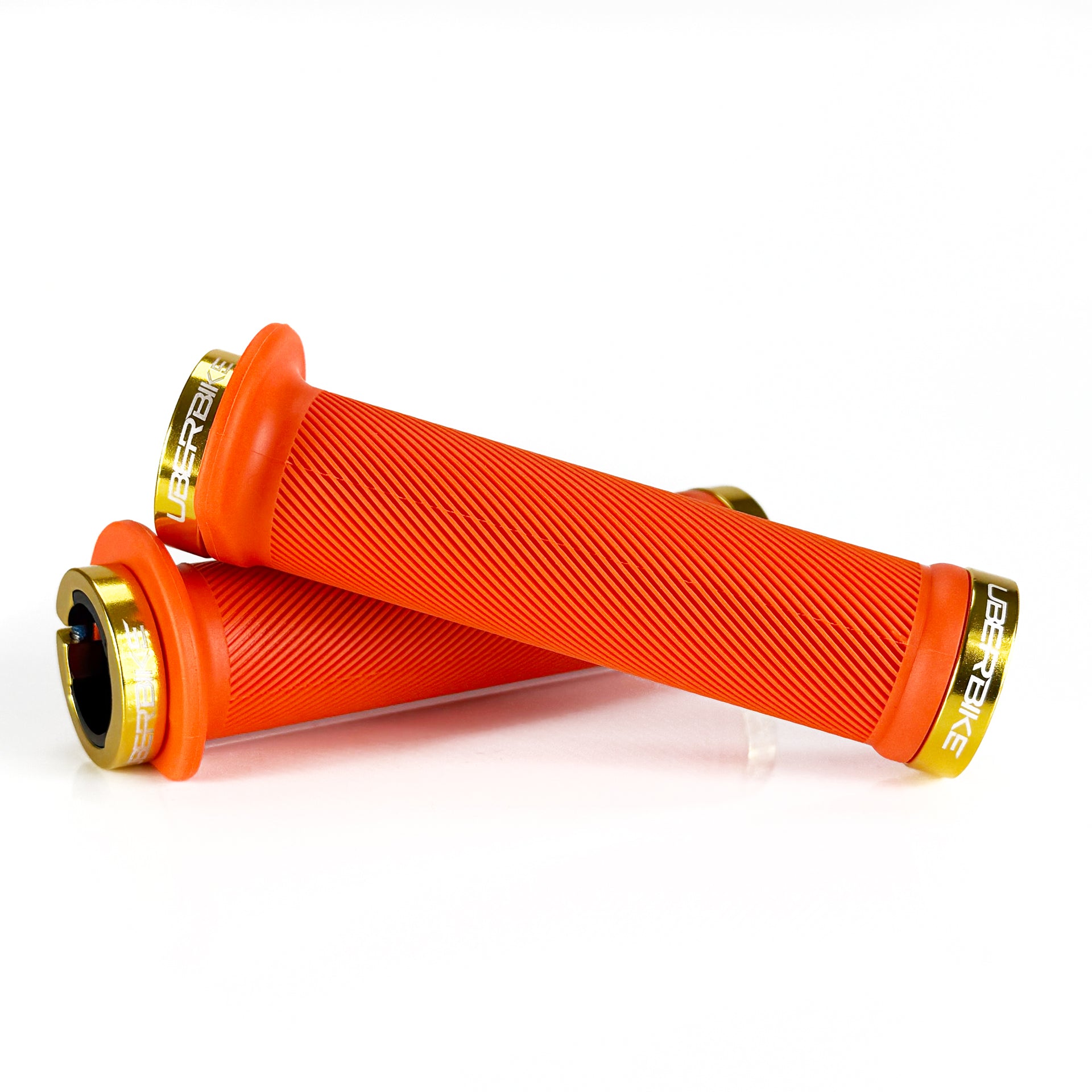 Mountain bike orange flange grip with gold lock rings on a white background