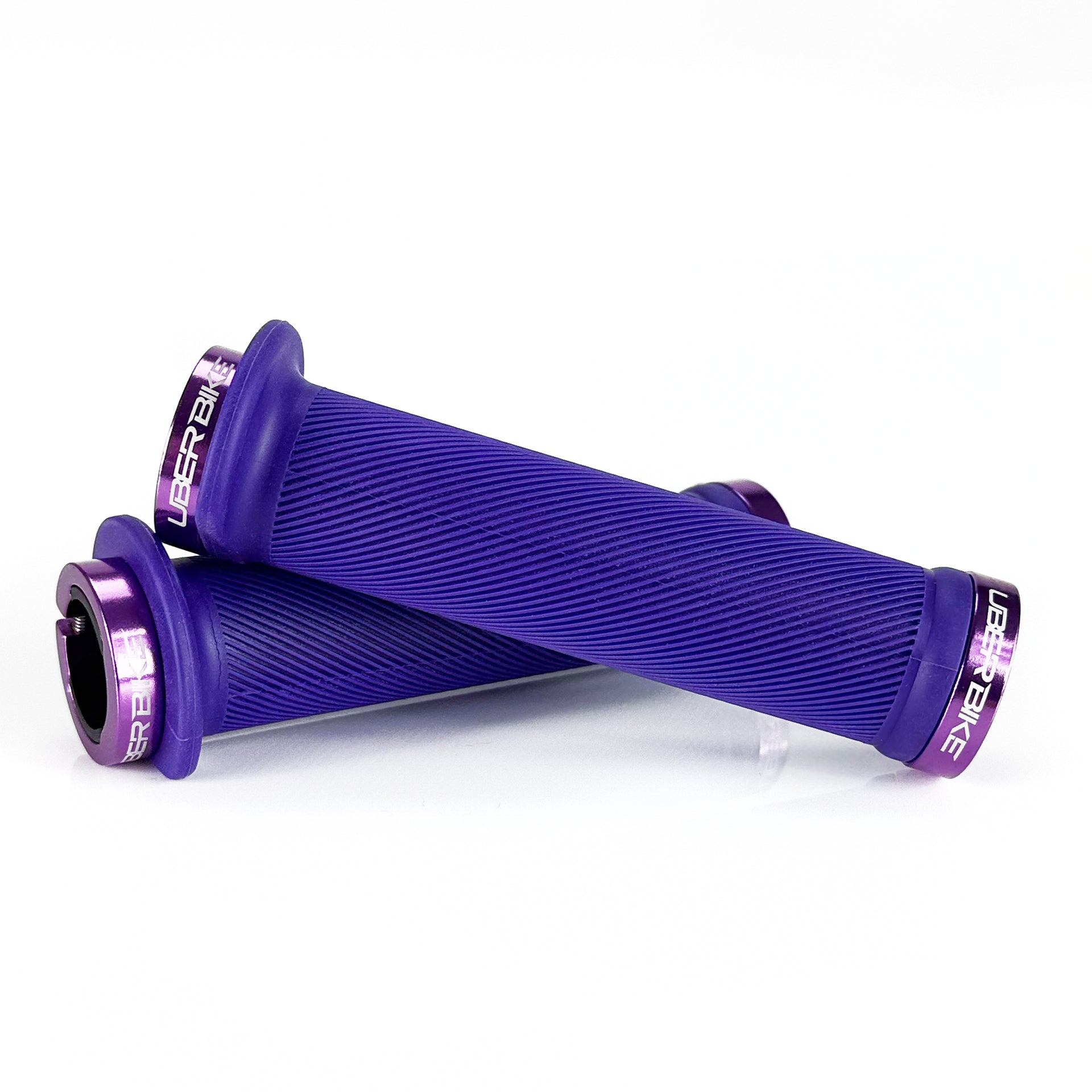Mountain bike purple flange grip with purple lock rings on a white background