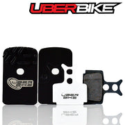 Fined Uberbike brake pads with Uberbike branding on a white background.