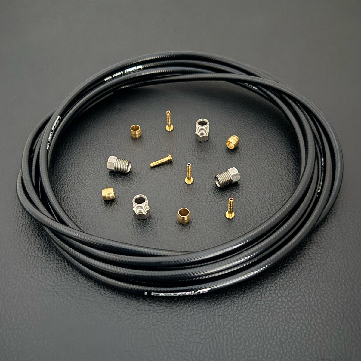 Formula Cura / Cura 4 / Cura X black hydraulic brake hose kit with straight connector fittings and Uberbike branding on a black background