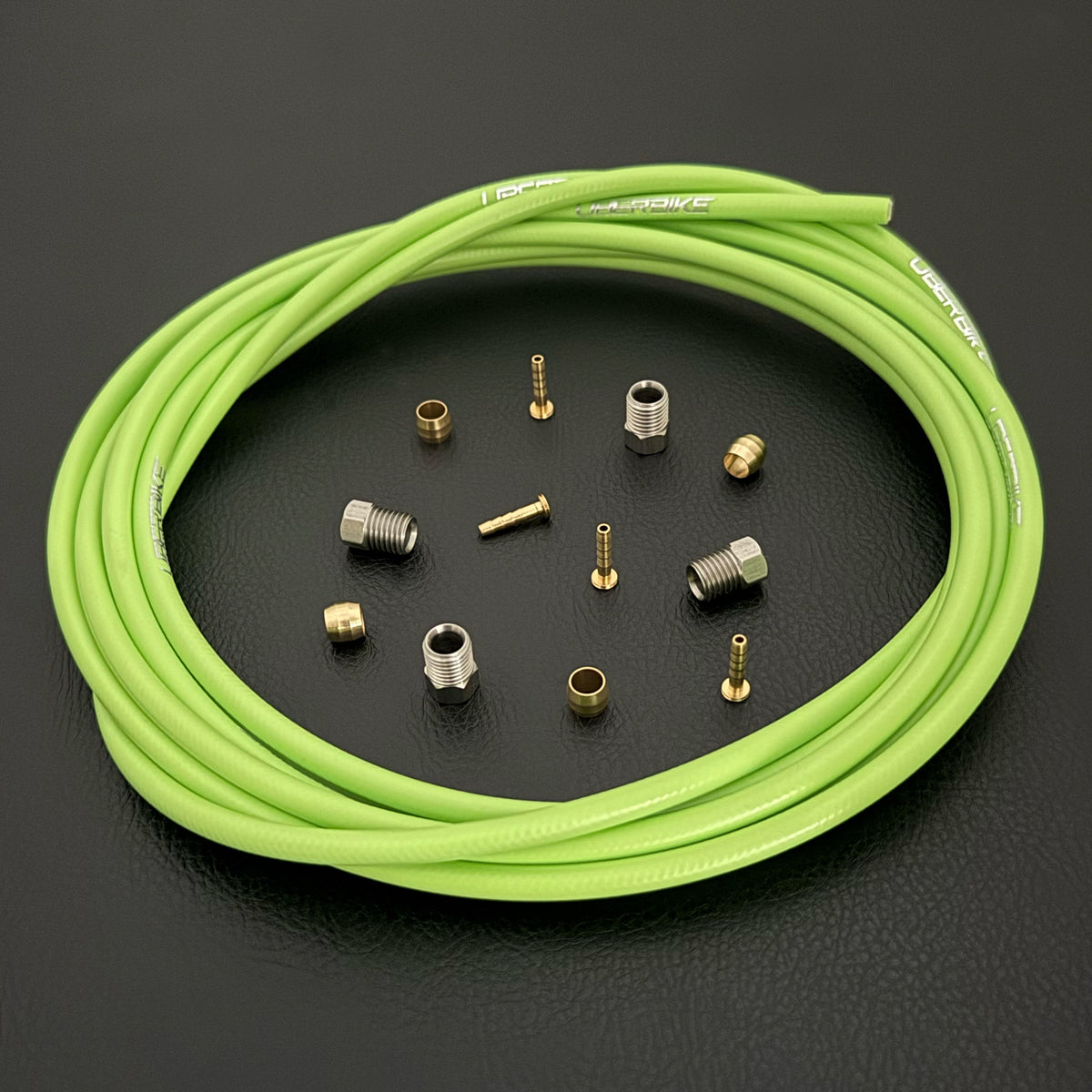 Formula Cura / Cura 4 / Cura X green hydraulic brake hose kit with straight connector fittings and Uberbike branding on a black background
