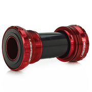 Red steel bottom bracket with a GXP adapter installed for SRAM, on a white background
