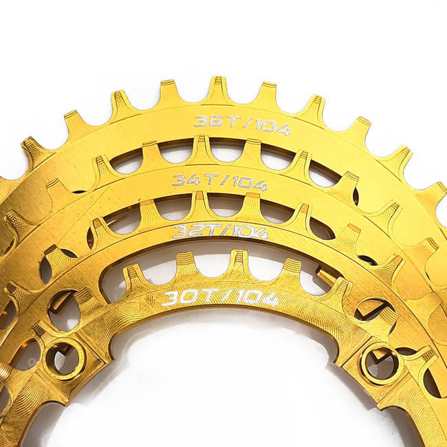 Gold bicycle chainring with measurement details on a white background