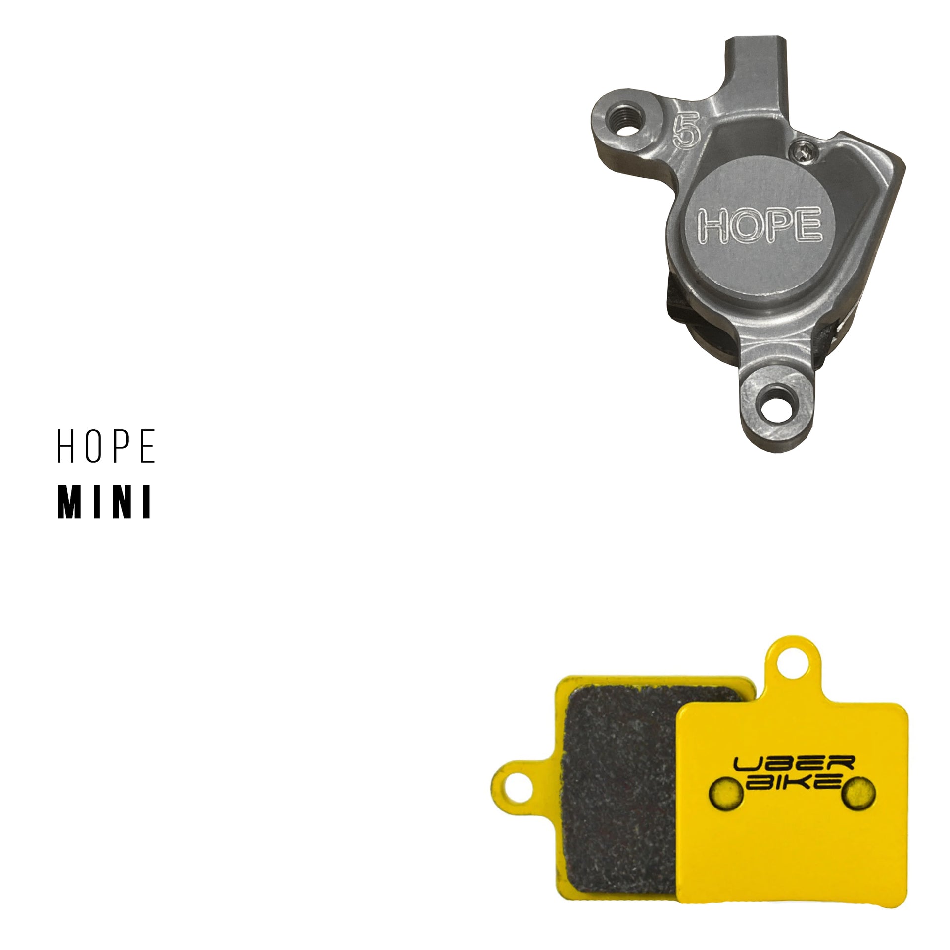 Hope brake component and yellow brake pads on a white background