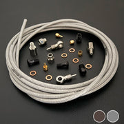 Hope MONO Mini raw silver stainless  hydraulic brake hose kit with banjo fittings and Uberbike branding on a black background with a colour panel in the bottom right hand corner