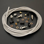 Hope tech 3 V4 raw silver braid stainless hydraulic brake hose kit with banjo fittings and Uberbike branding on a black background