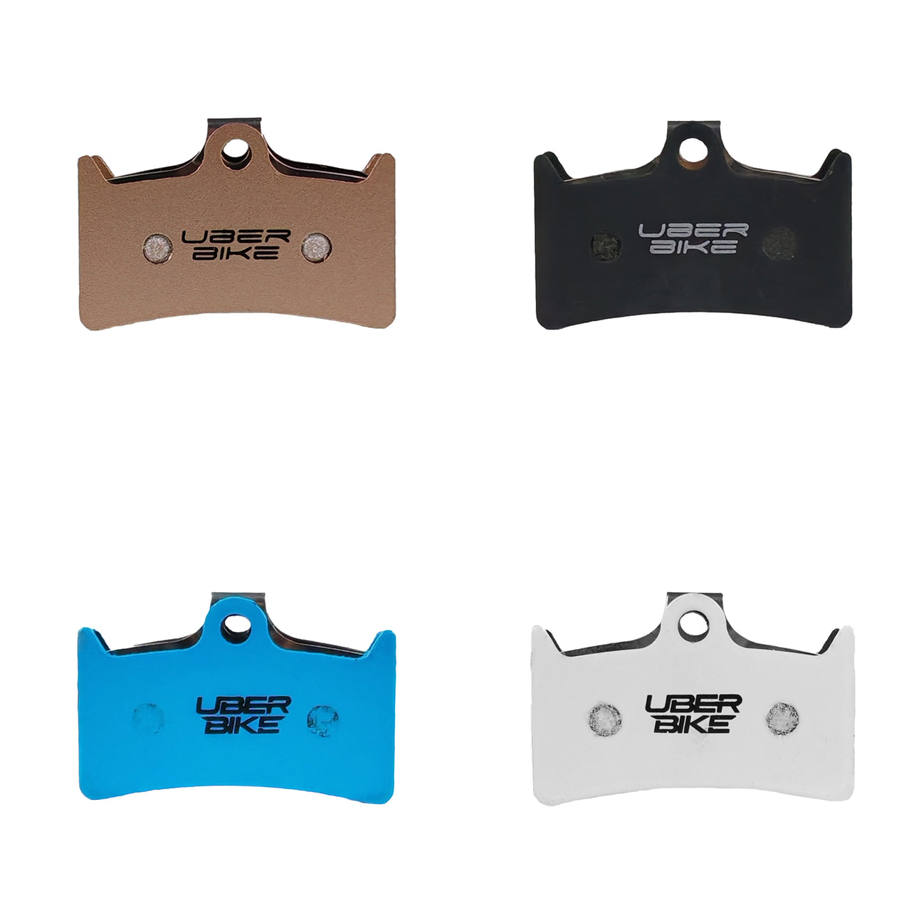 Uberbike branded brake pad inserts, showing 4 pairs in bronze, black, blue and white, on a white background