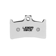 White Uberbike branded Hope V4 brake pad insert on a white background