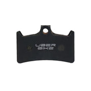 Black Uberbike branded brake pad insert on a white background