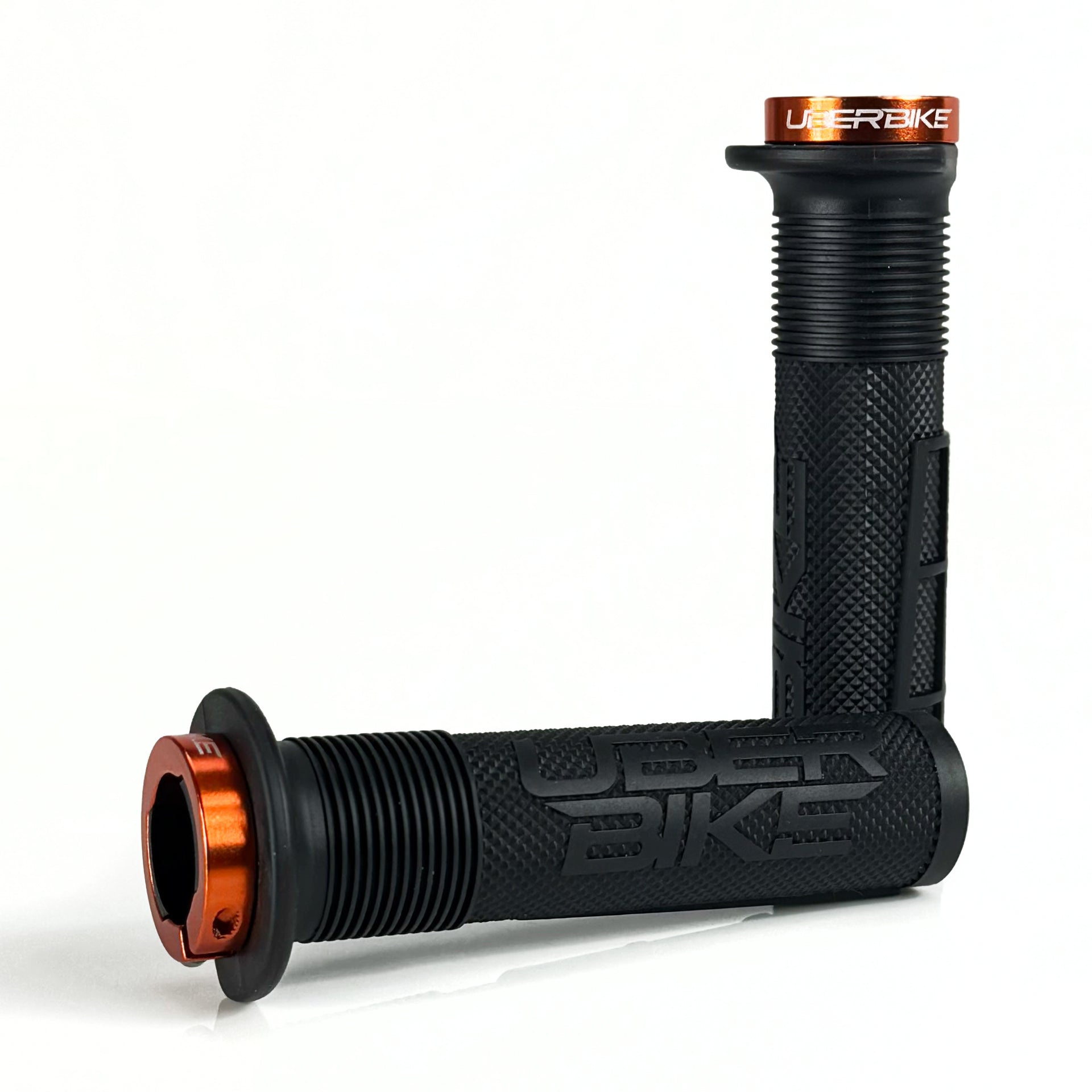 two black mushroom waffle mountain  bike grips and orange lockrings on a white background