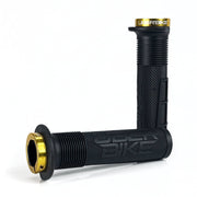 two black mushroom waffle mountain  bike grips and gold lockrings on a white background