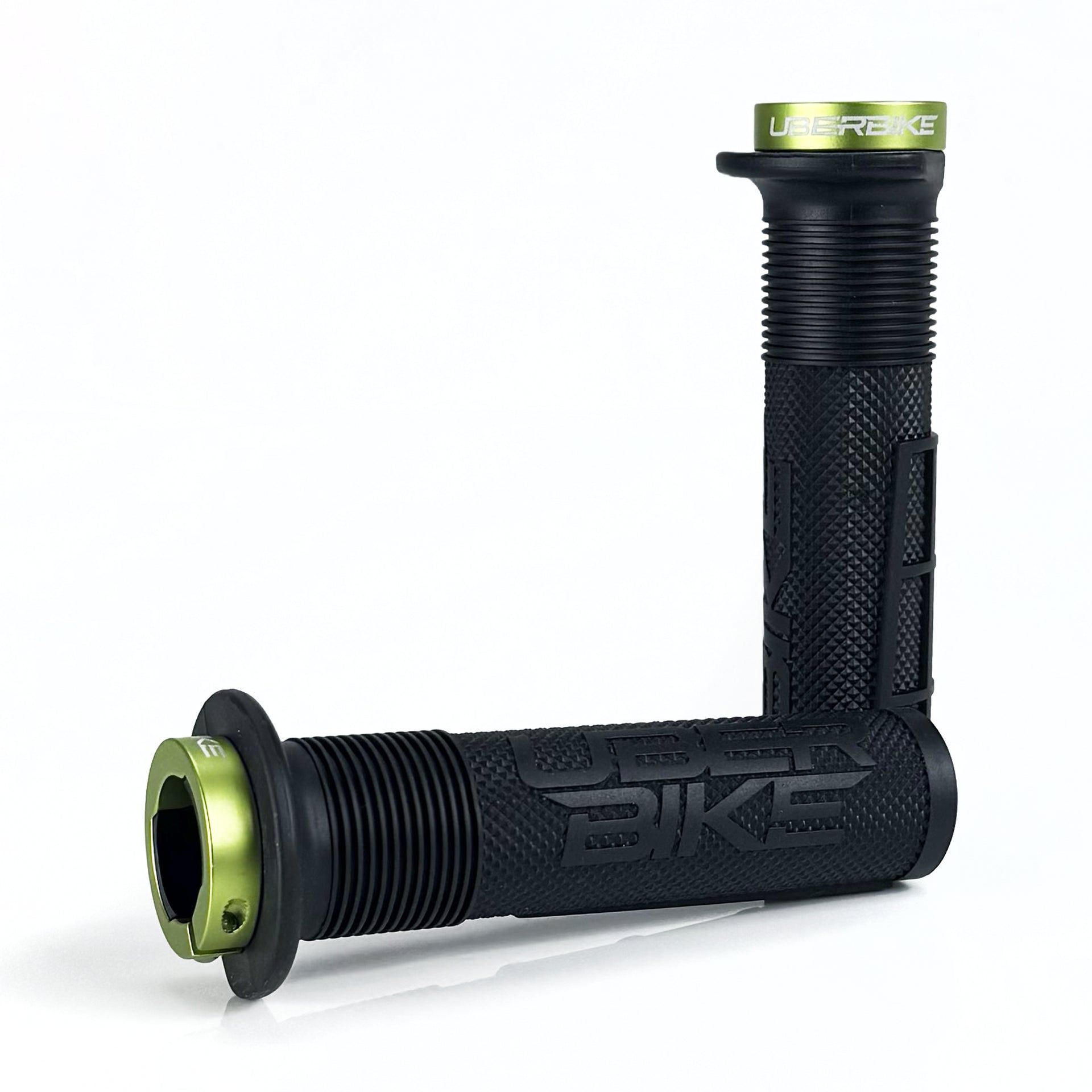 two black mushroom waffle mountain  bike grips and green lockrings on a white background