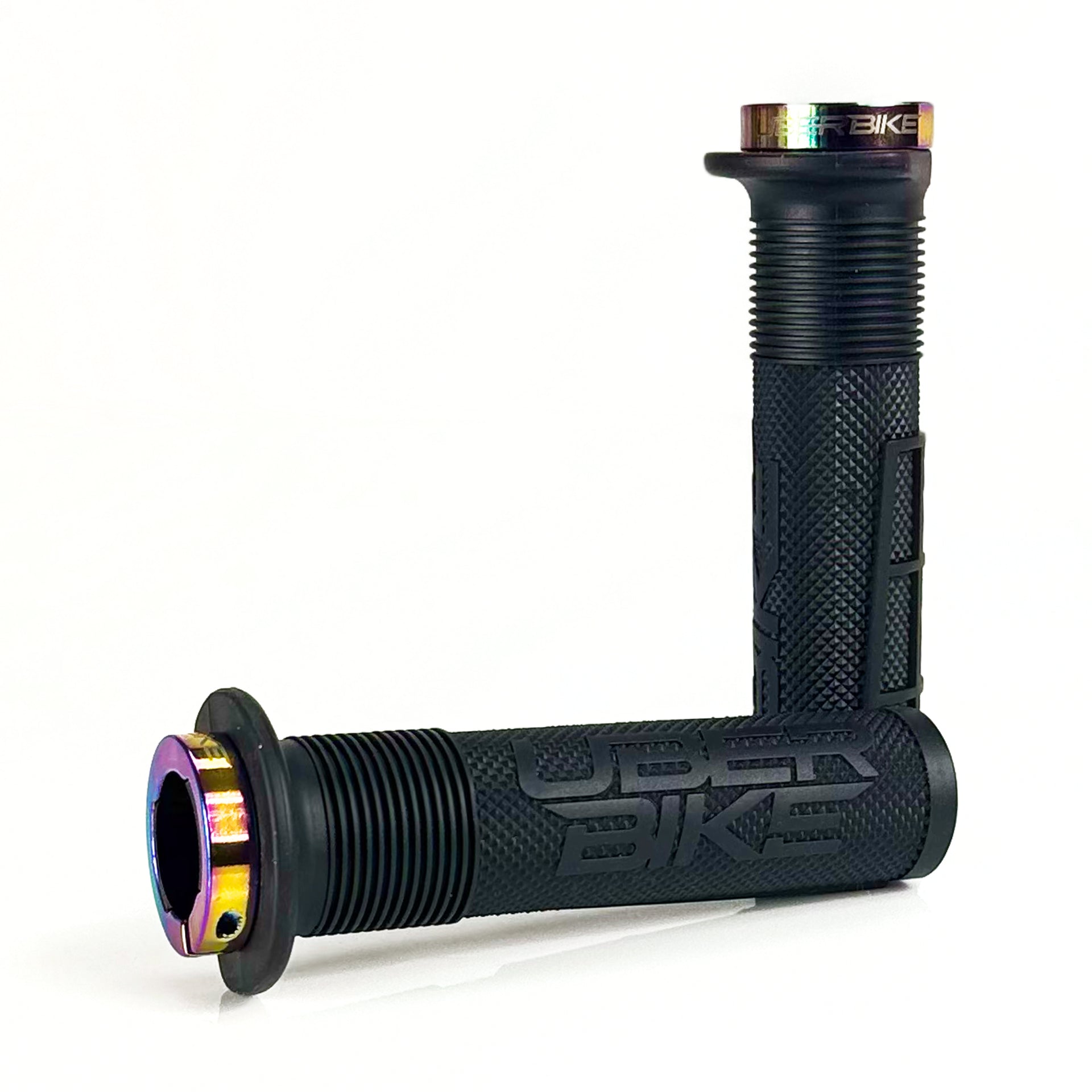 two black mushroom waffle mountain  bike grips and oil slick lockrings on a white background