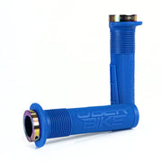 two blue mushroom waffle mountain  bike grips and oil slick lockrings on a white background