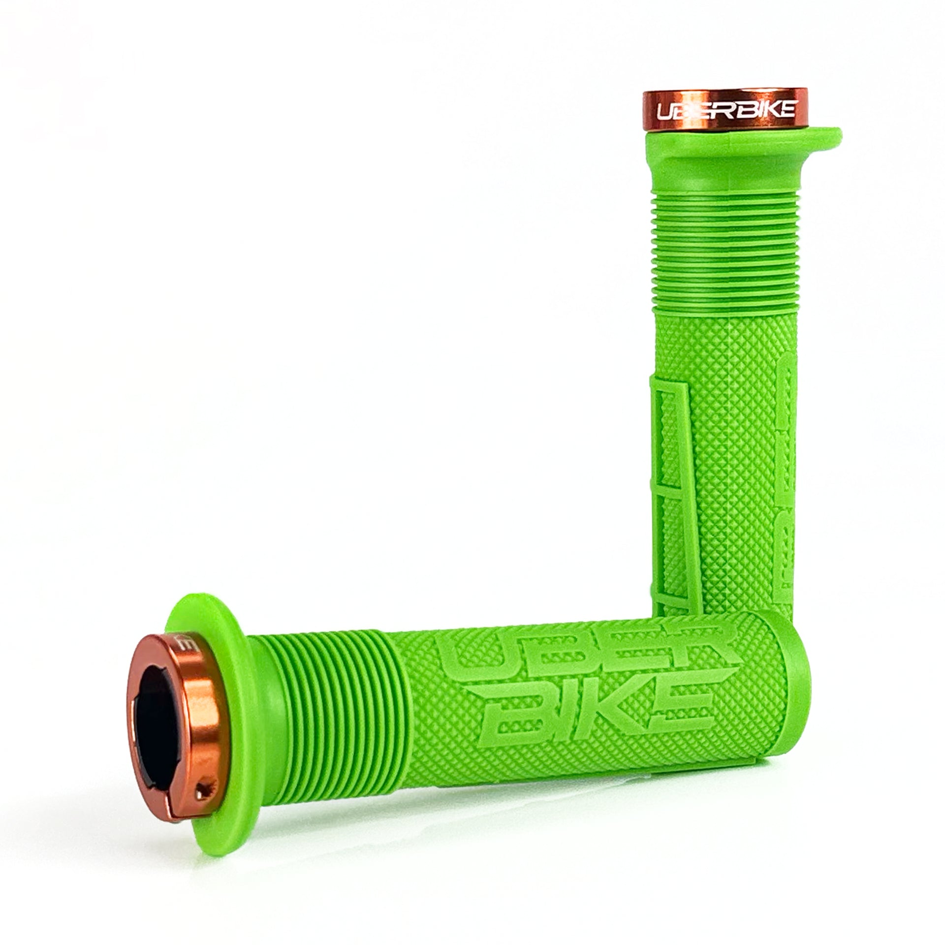 two green mushroom waffle mountain  bike grips and orange lockrings on a white background