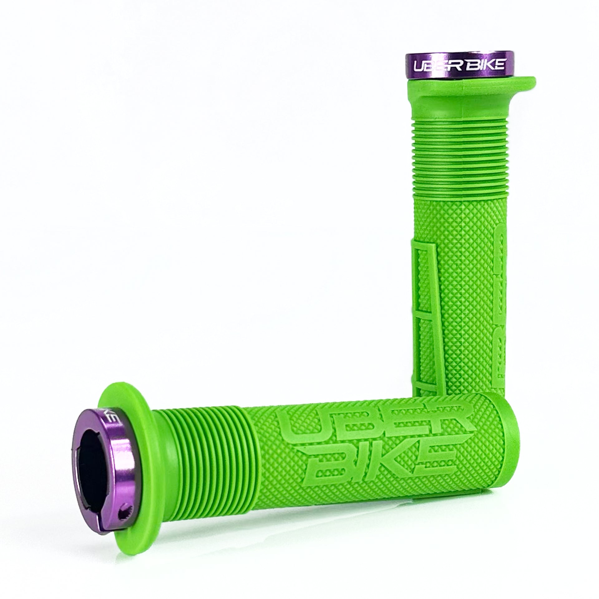 two green mushroom waffle mountain  bike grips and purple lockrings on a white background