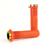 two orange mushroom waffle mountain  bike grips and orange lockrings on a white background